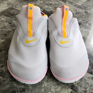 Nike Adult White Slip-On Sneakers with Yellow & Pink Highlights